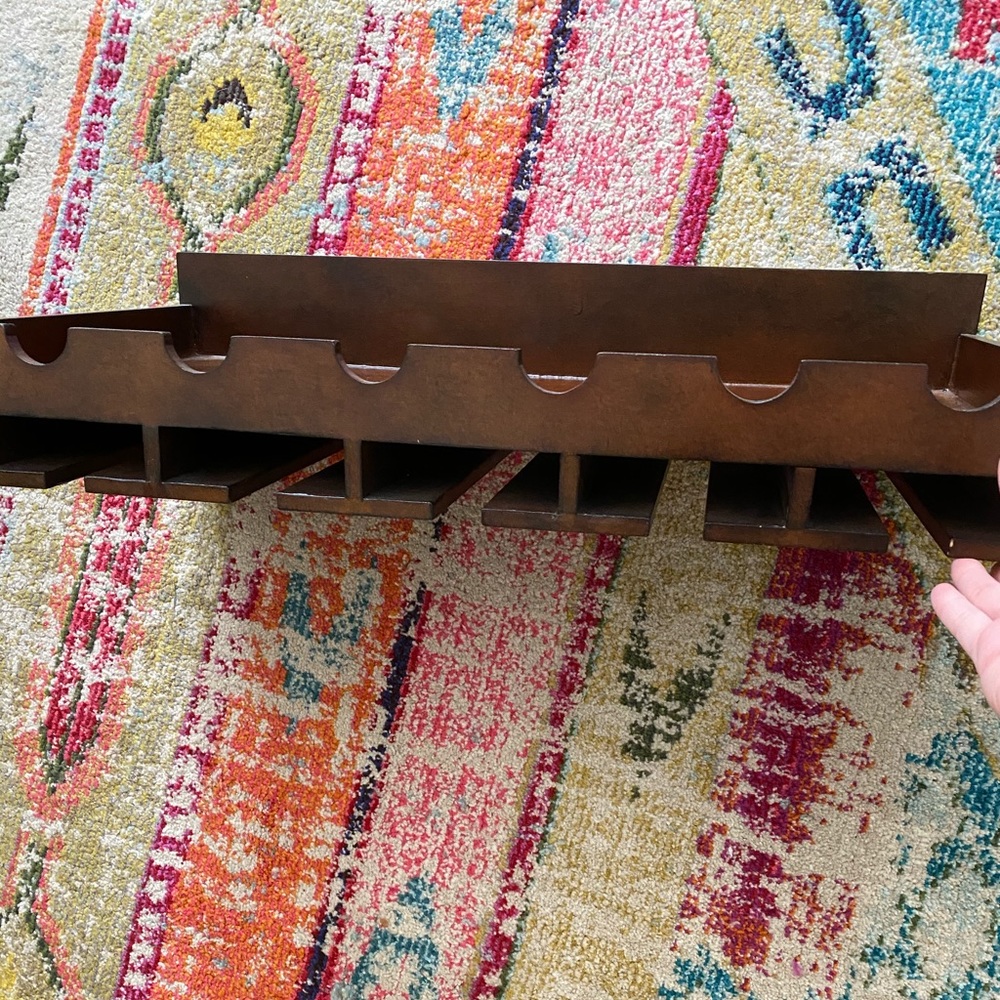Pier 1 wine shelf with wine glass slots.